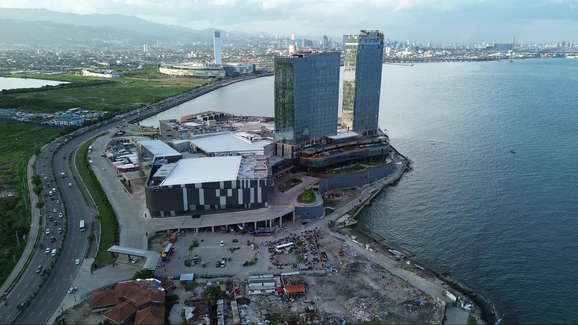 Historical construction-stage aerial image of the NUSTAR integrated resort in Cebu
