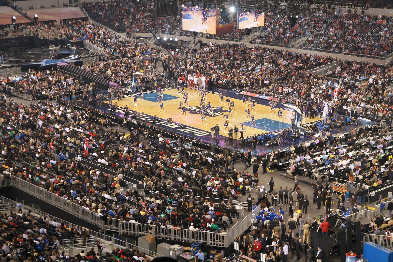 Cheerleaders perform on court before a packed crowd at the 2010 NBA All-Star Game in Cowboys Stadium, Arlington, Texas