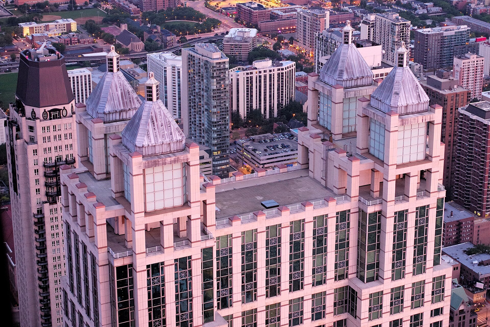 The top of the 900 North Michigan Avenue tower in Chicago, home to Rush Street Interactive headquarters, seen from above at dusk