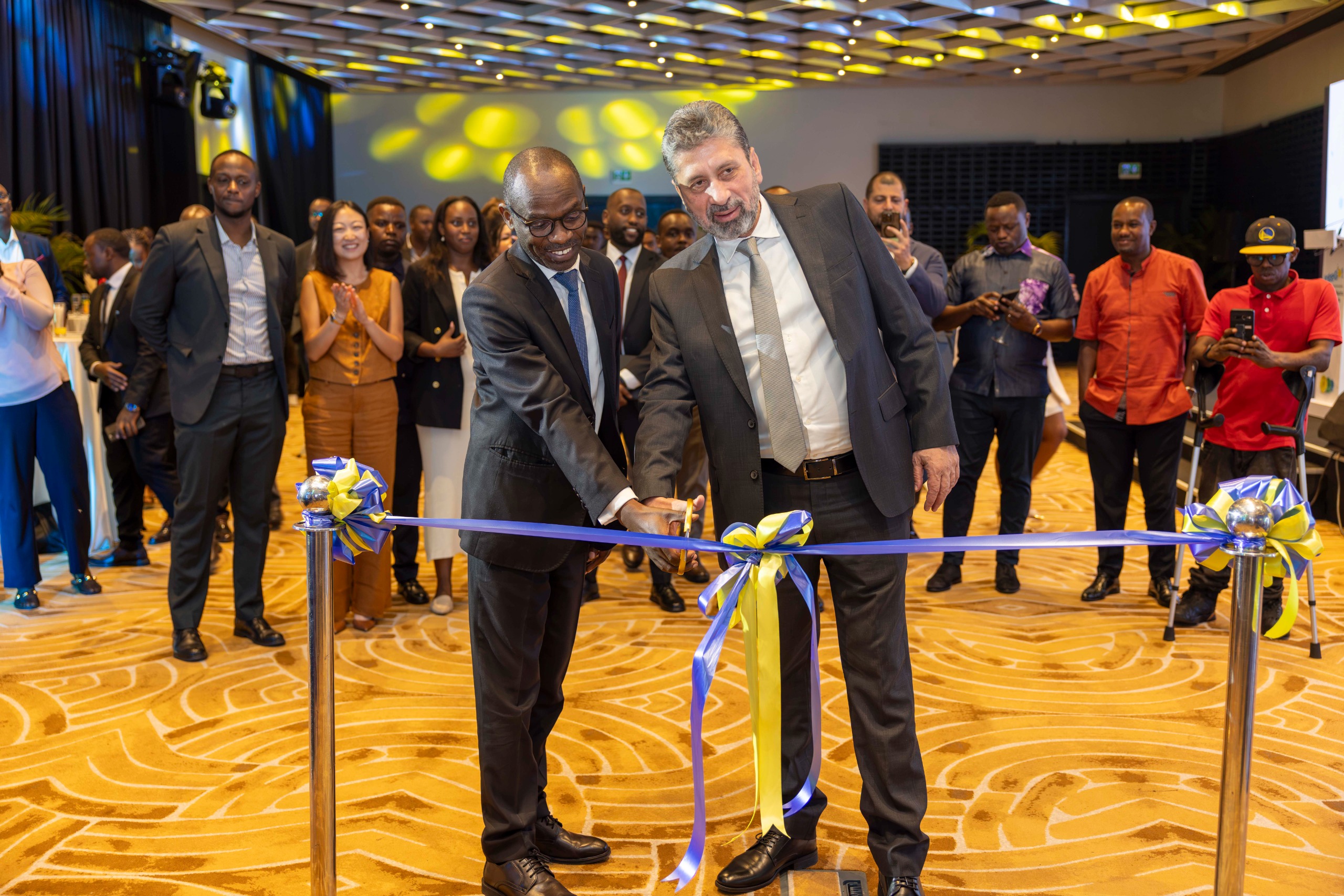 RDB Chief Licensing Officer Richard Kayibanda and Moja Group managing director Georges Boukazi cut the ribbon at the InteGo! launch in Kigali