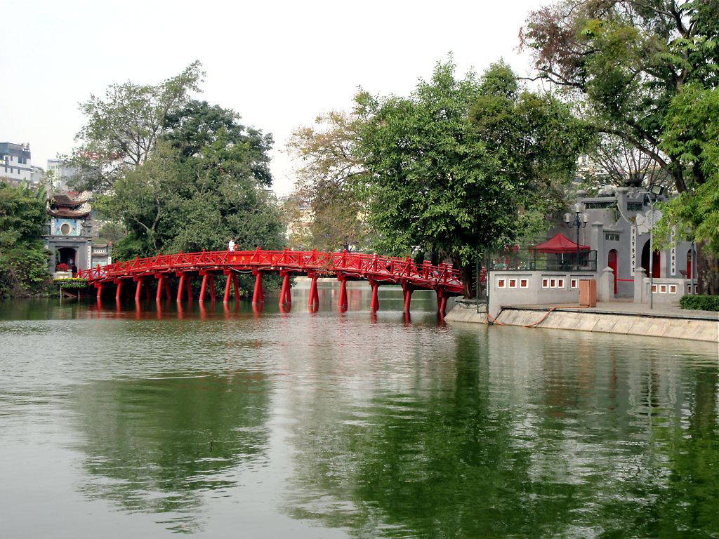 The red Thê Húc Bridge over Hoan Kiem Lake in Hanoi, Vietnam The red Thê Húc Bridge over Hoan Kiem Lake in Hanoi, Vietnam